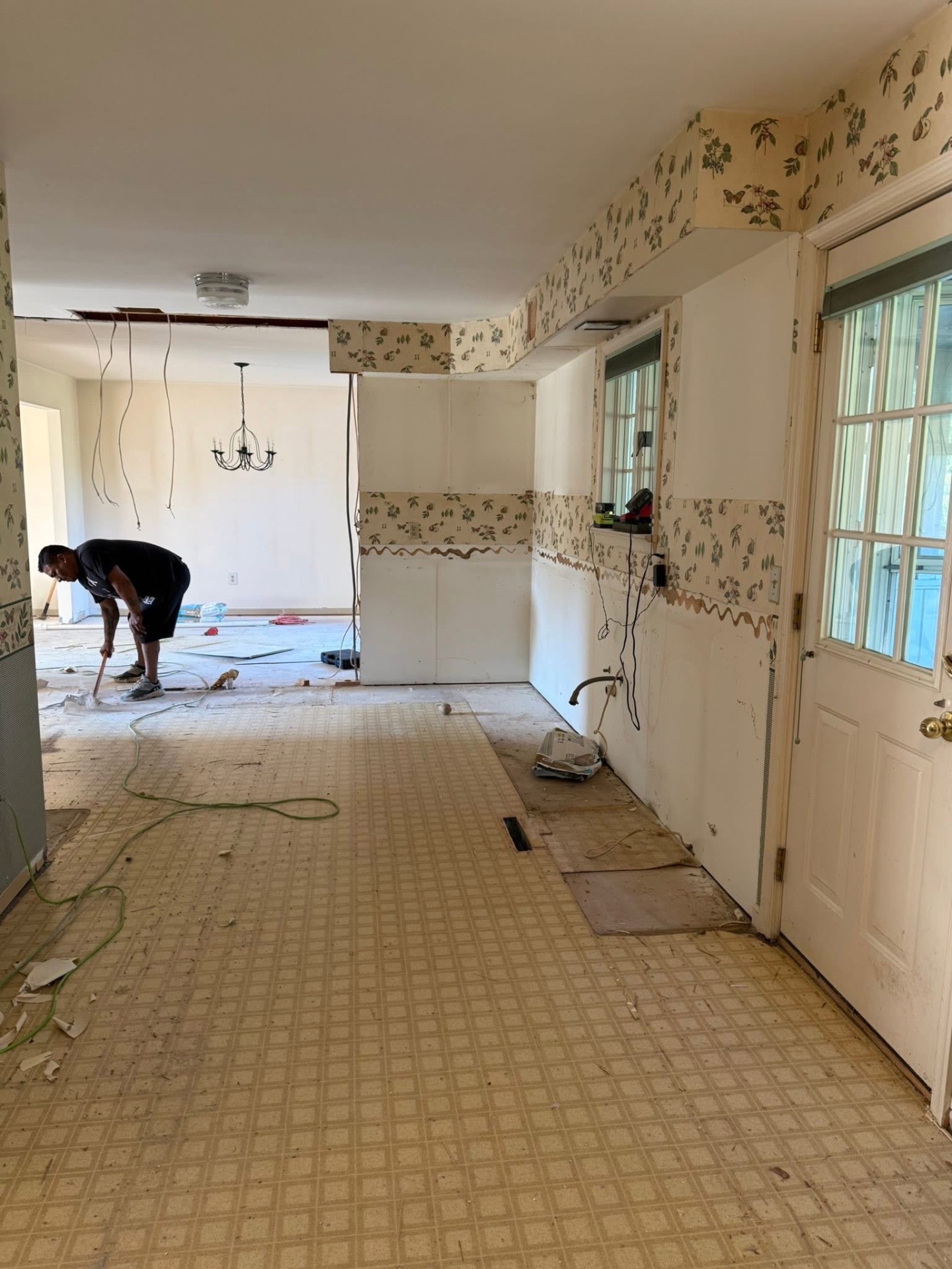 Kitchen subfloor prep with layout markings