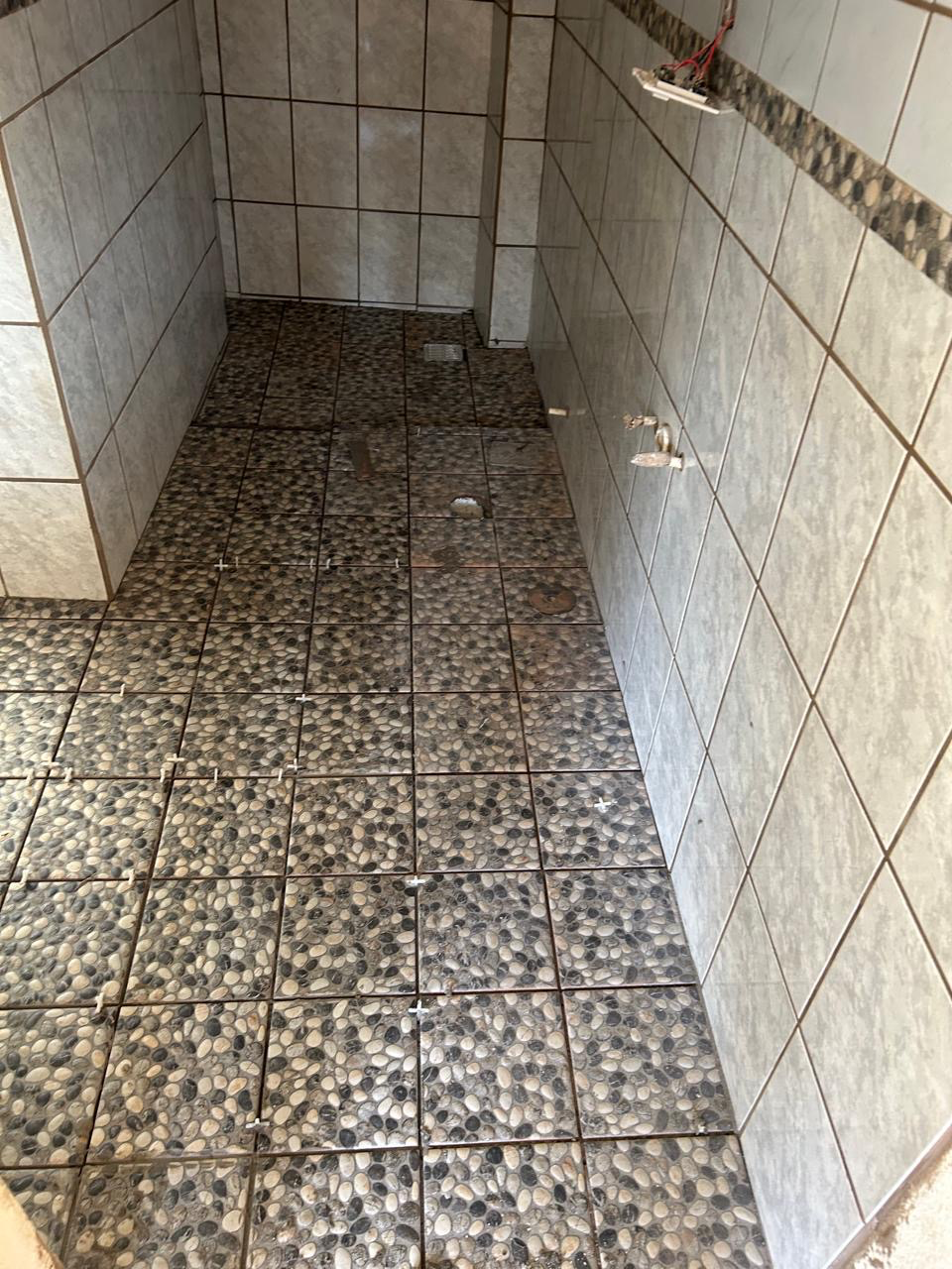 Custom pebble-tile shower floor