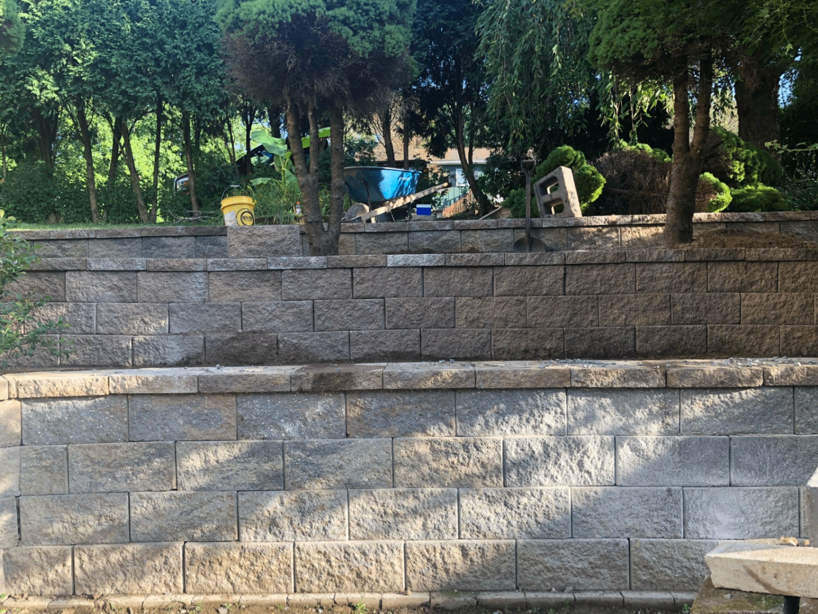Segmental block retaining wall built by MG Concrete & Renovations
